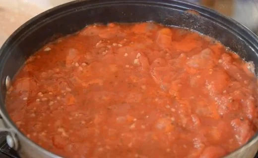 Break up the whole tomatoes